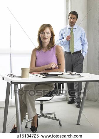 Business woman and man at the desk View Large Photo Image Stock Photography - Business woman and man at the desk. Fotosearch