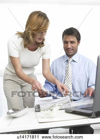 Business woman and man with a file View Large Photo Image Stock Image - Business woman and man with a file. Fotosearch