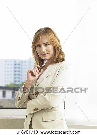 Stock Photo - Business woman with glasses in her hand. Fotosearch