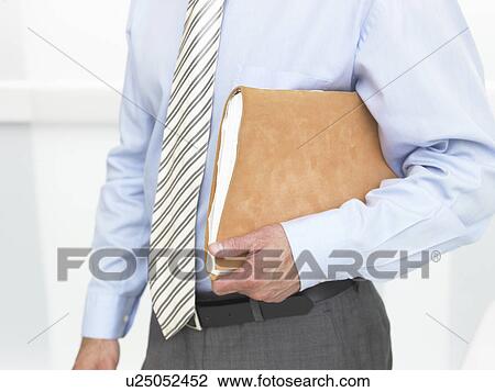 File under a business man arm View Large Photo Image Stock Image - File under a business man arm. Fotosearch