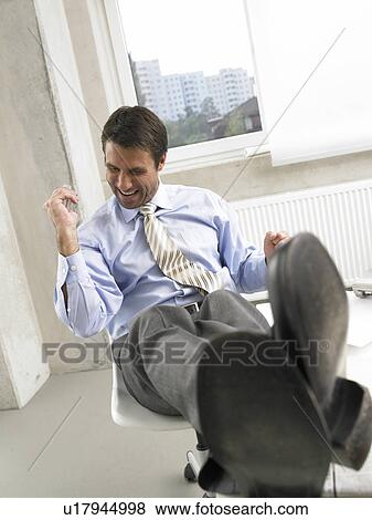 Stock Photo - Jubilating business man. Fotosearch