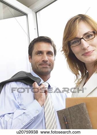 Stock Photo - Portrait of a business woman and a business man. Fotosearch