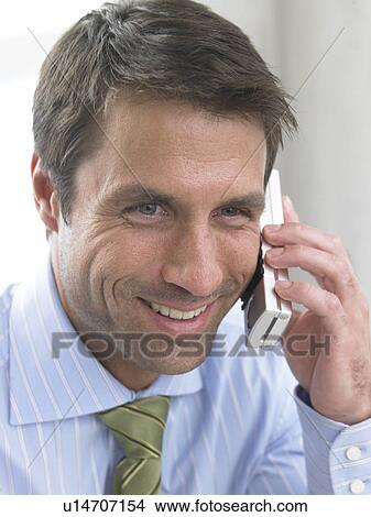 Telephoning business man View Large Photo Image Picture - Telephoning business man. Fotosearch