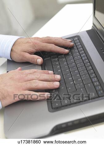 Typing with a notebook View Large Photo Image Stock Image - Typing with a notebook. Fotosearch
