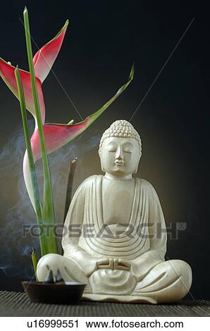 Buddha with joss sticks and Heleconia View Large Photo Image Stock Image - Buddha with joss sticks and Heleconia. Fotosearch