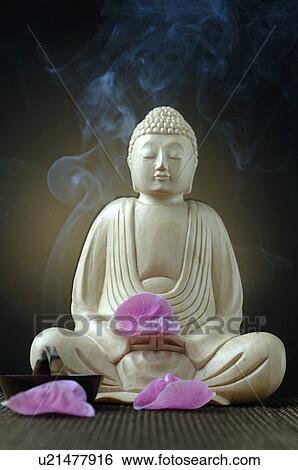 Buddha with joss sticks and pink petals View Large Photo Image Stock Photograph - Buddha with joss sticks and pink petals. Fotosearch