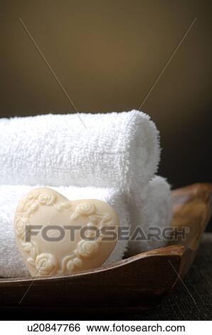Stock Photograph - Towels and soap in a bowl. Fotosearch