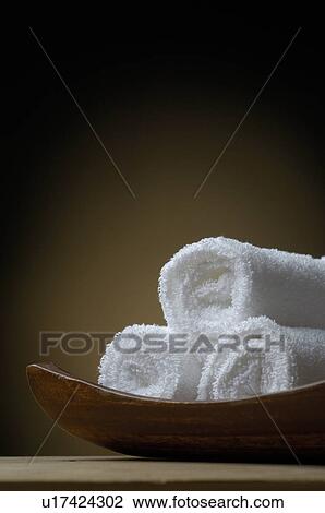 Stock Image - Towels in a bowl. Fotosearch