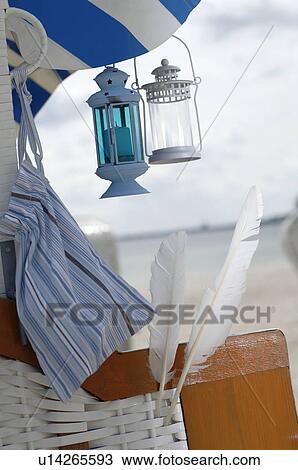 Beach chair with feathers and lanterns View Large Photo Image Stock Image - Beach chair with feathers and lanterns. Fotosearch