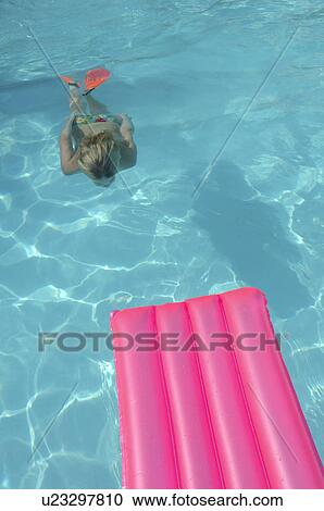 Diving woman with a air matress View Large Photo Image Stock Image - Diving woman with a air matress. Fotosearch