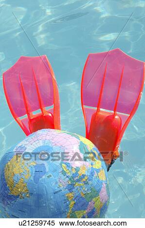 Stock Photography - Flippers and globe beach ball. Fotosearch
