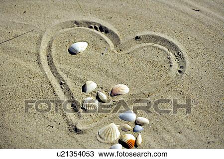 Stock Image - Heart in the sand. Fotosearch