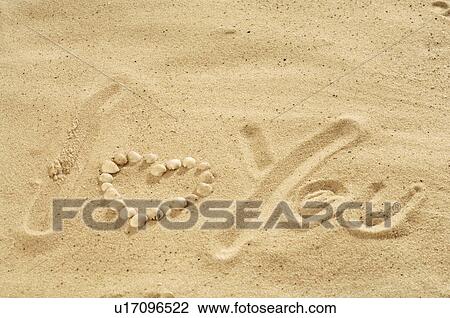 Stock Image - I love you' written in the sand. Fotosearch