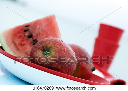 Stock Photo - Plate with watermelon and apples. Fotosearch