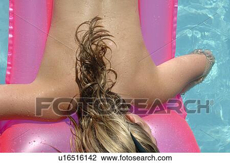 Stock Image - Woman on a air matress. Fotosearch