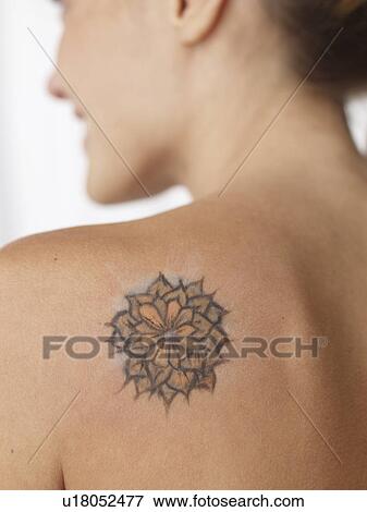 Flowery tattoo on a shoulder View Large Photo Image Stock Photo - Flowery tattoo on a shoulder. Fotosearch