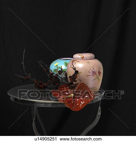 Vase, urn and flamingo flower on a small table View Large Photo Image Stock Image - Vase, urn and flamingo flower on a small table. Fotosearch