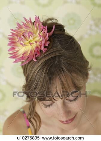 Woman having a chrysanthemum blossom in her hair View Large Photo Image Stock Photography - Woman having a chrysanthemum blossom in her hair. Fotosearch