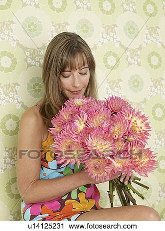 Woman with a bouquet of chrysanthemum View Large Photo Image Stock Image - Woman with a bouquet of chrysanthemum. Fotosearch