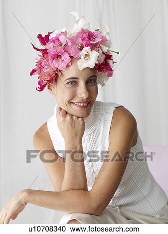 Woman with a flower cap View Large Photo Image Stock Image - Woman with a flower cap. Fotosearch