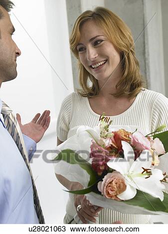 Stock Image - Couple with a bouquet. Fotosearch