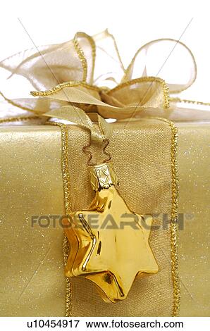 Gift with a gold pendants View Large Photo Image Stock Photo - Gift with a gold pendants. Fotosearch