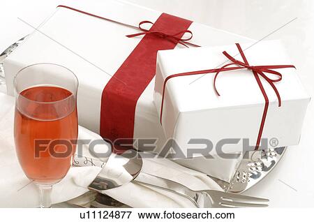 Gifts and sparkling wine View Large Photo Image Stock Photo - Gifts and sparkling wine. Fotosearch