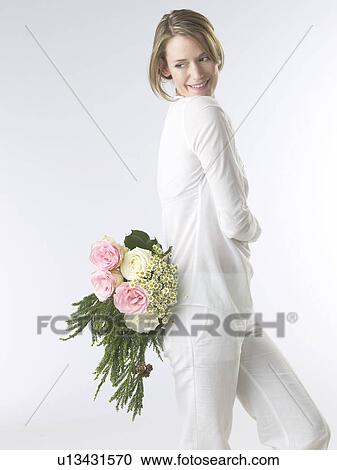 Woman with a bouquet View Large Photo Image Stock Image - Woman with a bouquet. Fotosearch