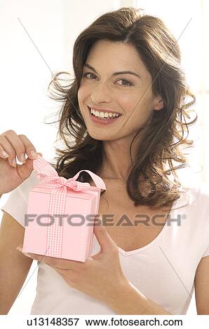 Woman with a gift View Large Photo Image Stock Photo - Woman with a gift. Fotosearch