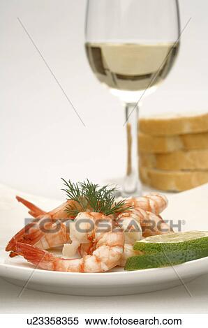 Dish of prawn, rice and lime and a glass of wine View Large Photo Image Stock Photography - Dish of prawn, rice and lime and a glass of wine. Fotosearch