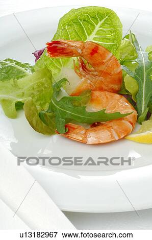 Dish of shrimps, lemon and salad View Large Photo Image Stock Photo - Dish of shrimps, lemon and salad. Fotosearch