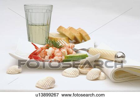 Stock Photo - Glass, white bread and shrimps. Fotosearch