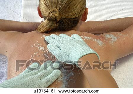 Salt peeling treatment with gloves View Large Photo Image Stock Image - Salt peeling treatment with gloves. Fotosearch