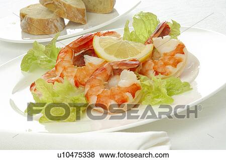 Shrimps with salad and lemon View Large Photo Image Stock Photo - Shrimps with salad and lemon. Fotosearch