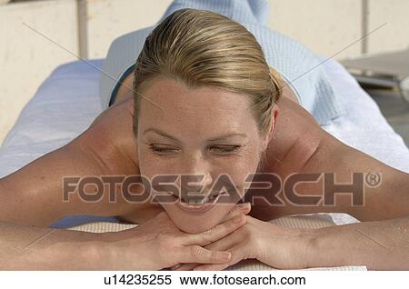 Woman on the massage table View Large Photo Image Stock Photography - Woman on the massage table. Fotosearch