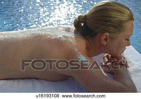 Woman with salt peeling on her back View Large Photo Image Stock Photo - Woman with salt peeling on her back. Fotosearch