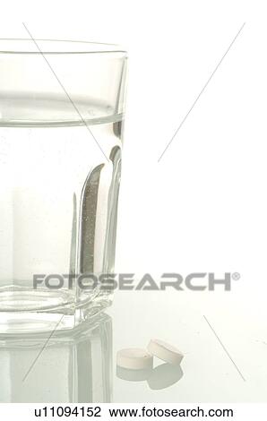 Dr. Schüssler's cell salts pills and a glass of water View Large Photo Image Stock Image - Dr. Schüssler's cell salts pills and a glass of water. Fotosearch