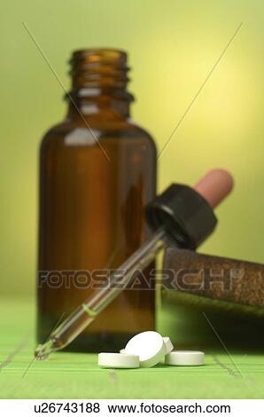 Stock Photo - Dr. Schüssler's cell salts pills and a pipette. Fotosearch