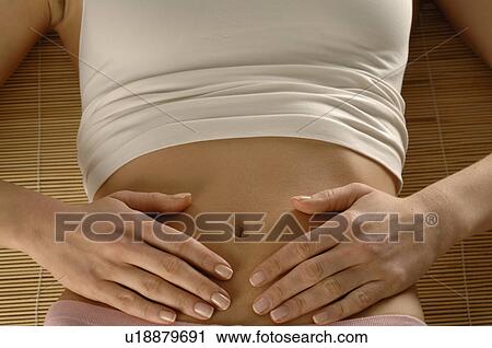 Woman lying on a mat View Large Photo Image Stock Image - Woman lying on a mat. Fotosearch