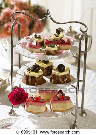 Stock Image - Etagere with tartlets and Petit Fours. Fotosearch