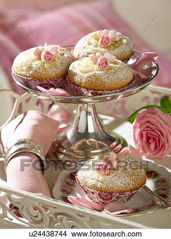 Picture - Muffins in a small silver cup. Fotosearch
