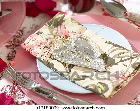Stock Photo - Napkin with a heart shape hanger. Fotosearch