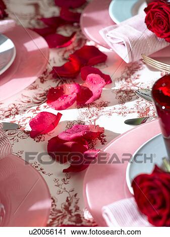Stock Image - Rose petal table decoration. Fotosearch