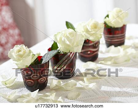 White roses in red glasses View Large Photo Image Stock Image - White roses in red glasses. Fotosearch