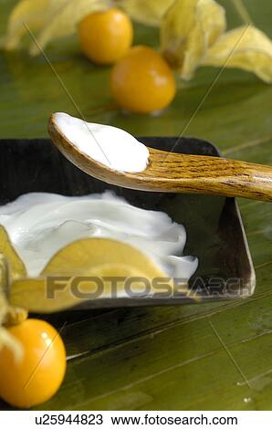 Stock Image - Cosmetic cream and physalis fruit. Fotosearch