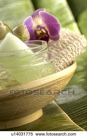 Stock Photography - Creme pot and a orchid blossom. Fotosearch