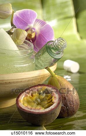 Creme pot flacon and an orchid blossom with passion fruit View Large Photo Image Stock Photograph - Creme pot flacon and an orchid blossom with passion fruit. Fotosearch