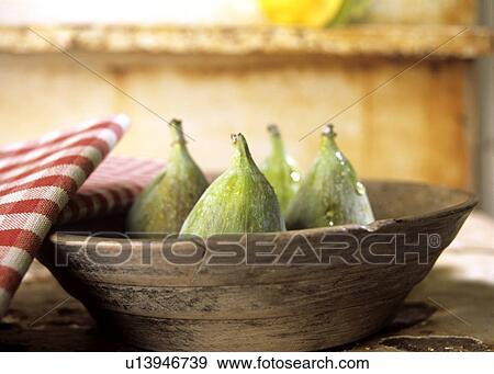 Fresh figs in a wooden bowl View Large Photo Image Stock Photo - Fresh figs in a wooden bowl. Fotosearch