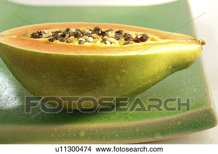 Picture - Sliced pawpaw (Carica papaya). Fotosearch