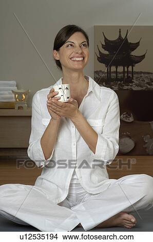 Young woman with a tea mug View Large Photo Image Picture - Young woman with a tea mug. Fotosearch